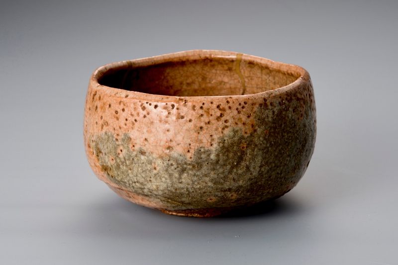 A Rare Tamamizu Red Raku Tea Bowl with Gold Repairs