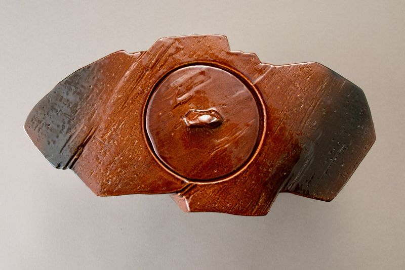 A Red “Ame” Glazed Mizusashi by 11th Generation Ōhi Chozaemon