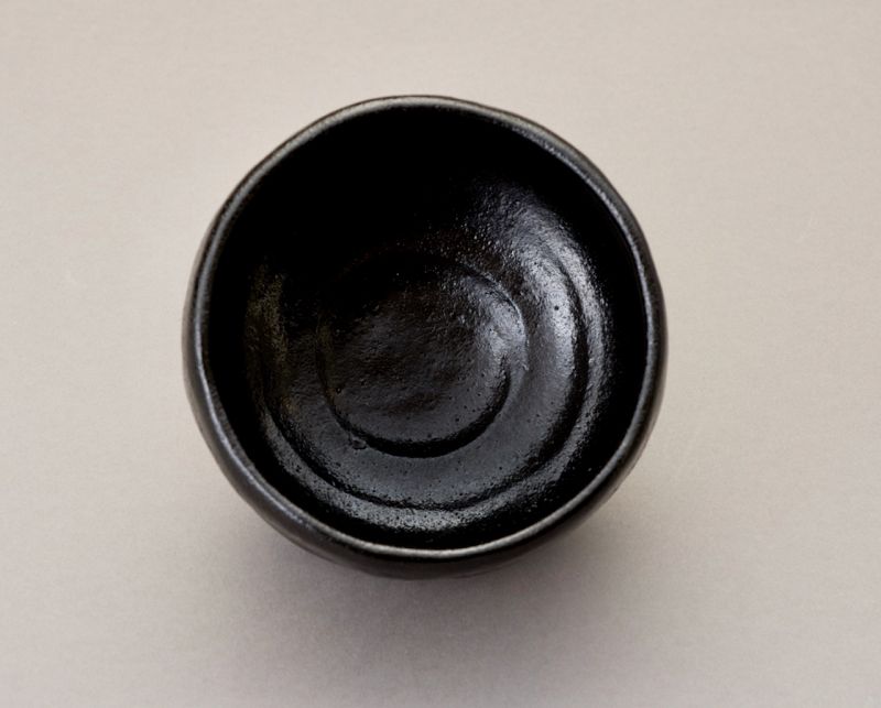 A Black Raku “Kazuin” Tea Bowl by Higaki Soroku
