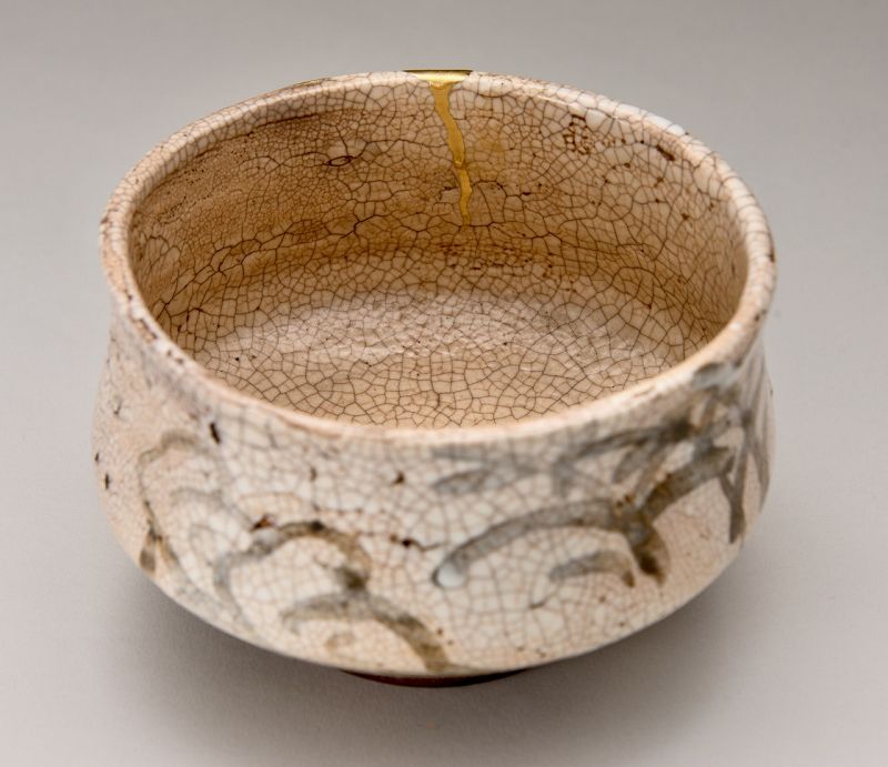 An Edo Period Shino Tea Bowl with Gold Repairs