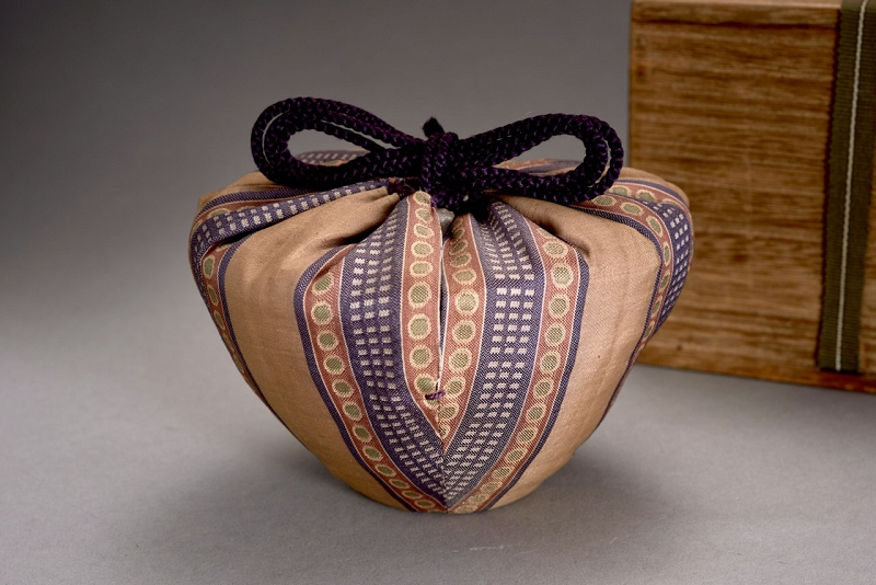 An Antique Karatsu Amigasa Tea Bowl with Shifuku