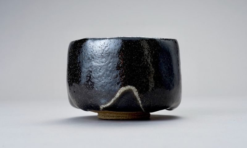 A Classic Black Raku Tea Bowl by Ōhi Chōzaemon IX