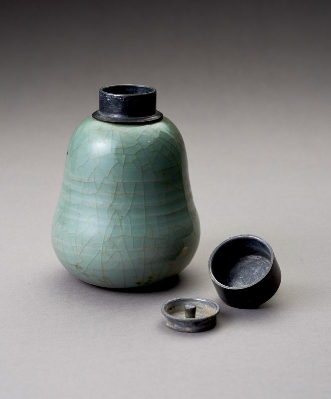 An Antique Celadon Tea Container with Pewter Cap