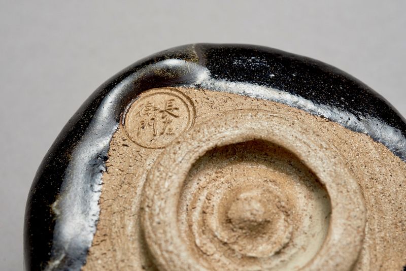 A Classic Black Raku Tea Bowl by Ōhi Chōzaemon IX