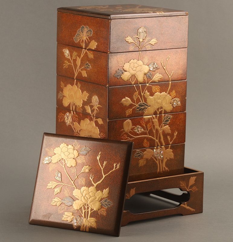 A Meiji Period Maki-e Gold Painted Five-tiered Jubako Set