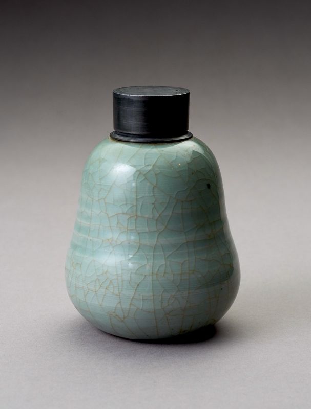An Antique Celadon Tea Container with Pewter Cap