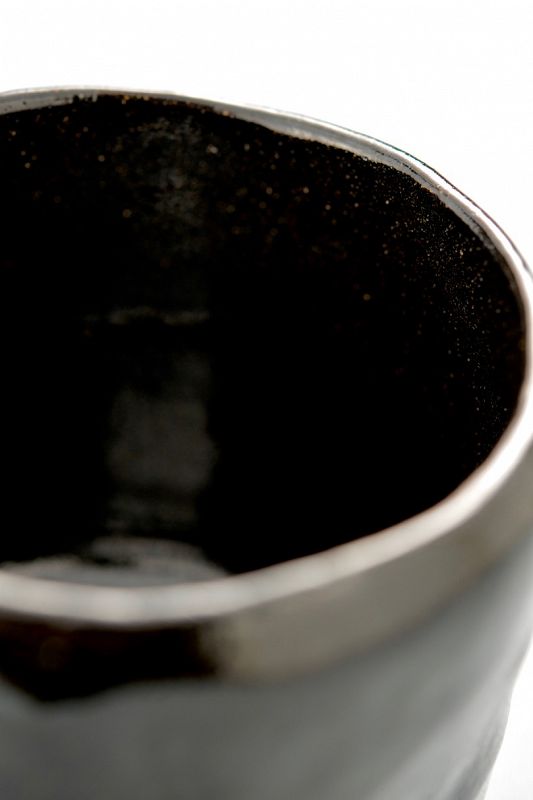 A Black Raku Tea Bowl by Ito Tozan