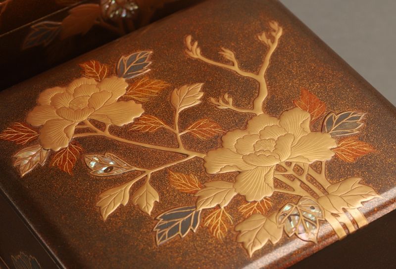 A Meiji Period Maki-e Gold Painted Five-tiered Jubako Set