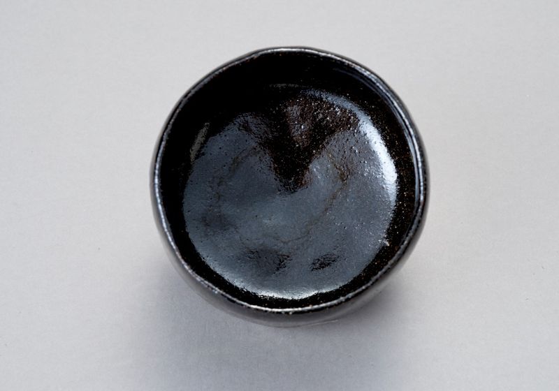 A Classic Black Raku Tea Bowl by Ōhi Chōzaemon IX