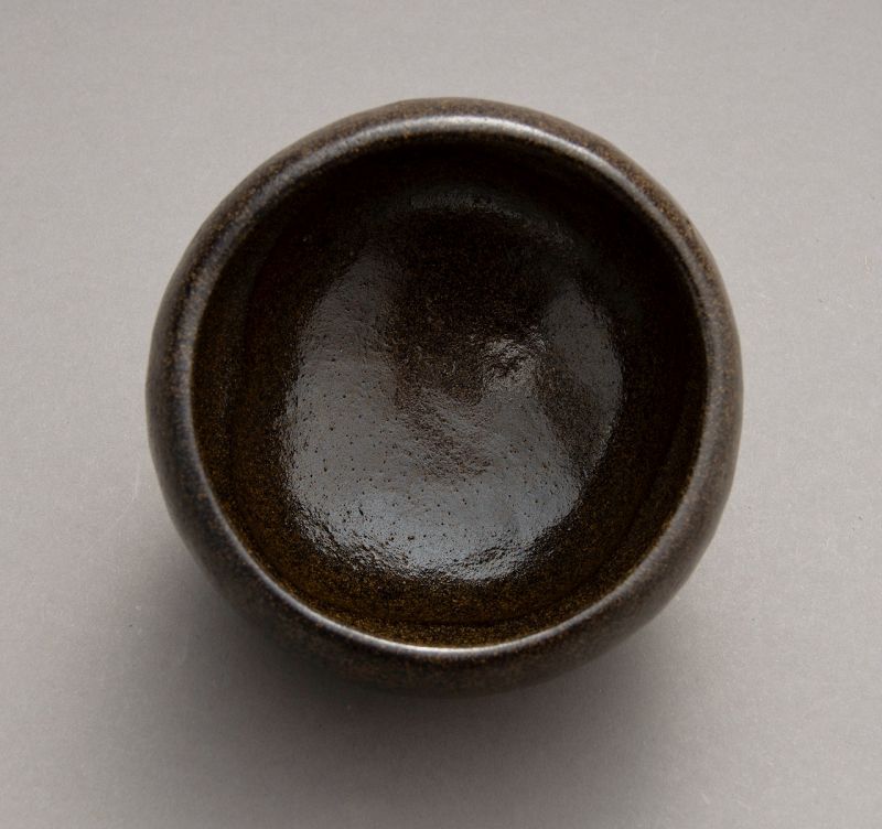 A “Kase-Guro” Raku Tea Bowl by Higaki Ryota