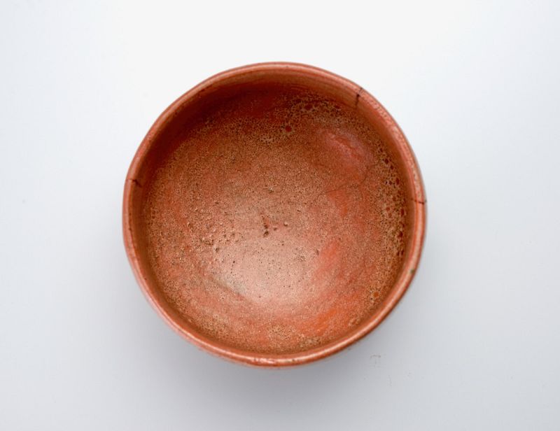 A Red Raku Tea Bowl by Tamamizu III - Nindosai (d.o.b. unknown -1763)