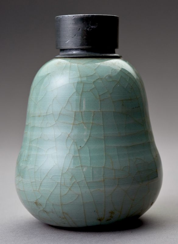 An Antique Celadon Tea Container with Pewter Cap