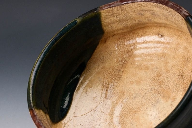 An Edo Period Oribe Tea Bowl with Green Glaze