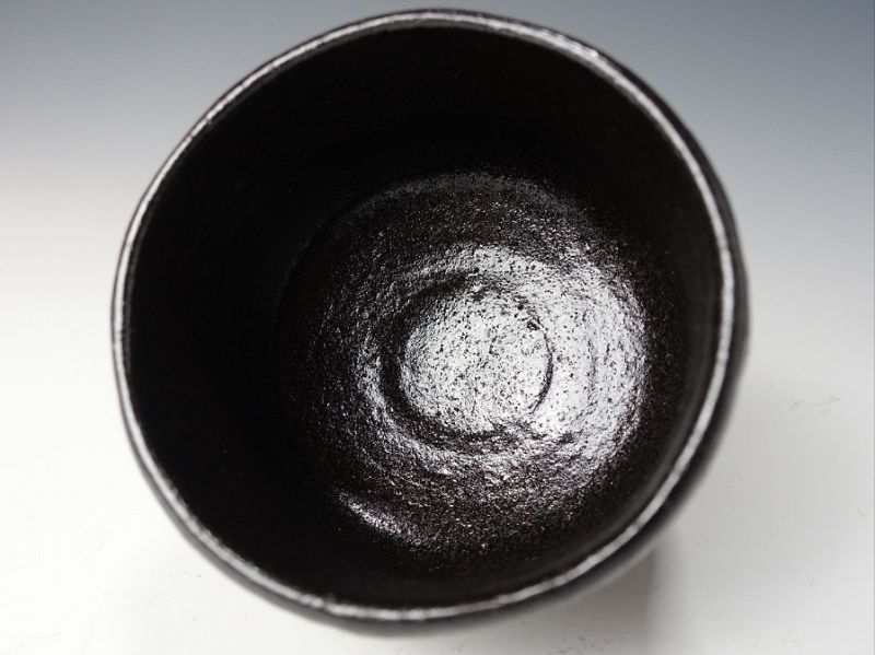 A Black Raku Tribute Tea Bowl by Kiraku Kizu