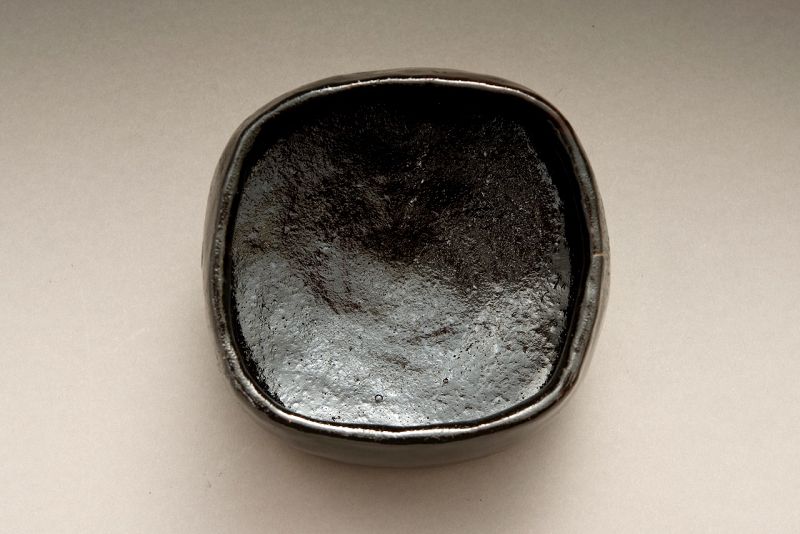 A Four Cornered Black Raku “Jidai” Chawan