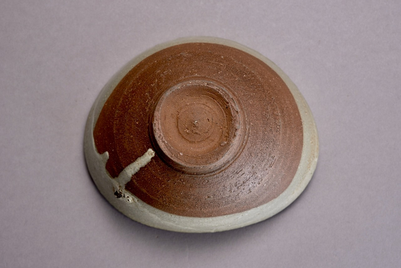 An Antique Karatsu Amigasa Tea Bowl with Shifuku