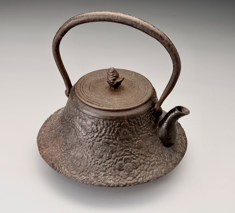 A Meiji Period “Tetsubin” Cast Iron Kettle with Cherry Blossom Motif