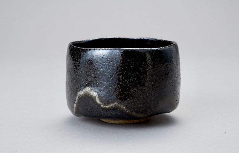 A Classic Black Raku Tea Bowl by Ōhi Chōzaemon IX
