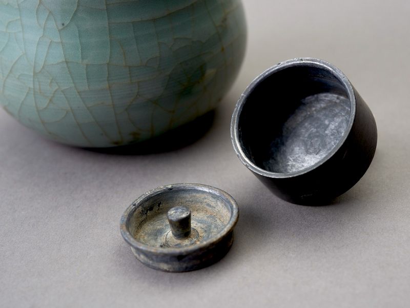 An Antique Celadon Tea Container with Pewter Cap