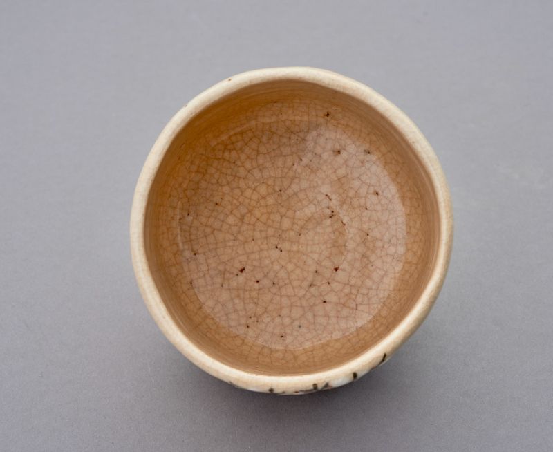 A White Raku Tea Bowl by First Generation Ito Tozan