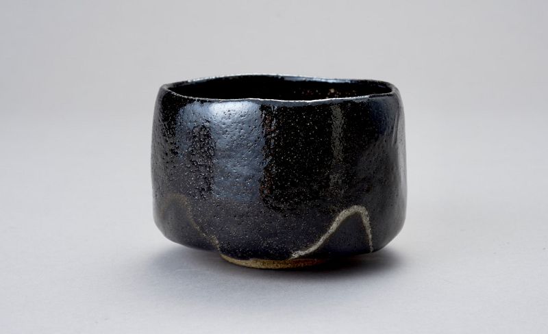 A Classic Black Raku Tea Bowl by Ōhi Chōzaemon IX