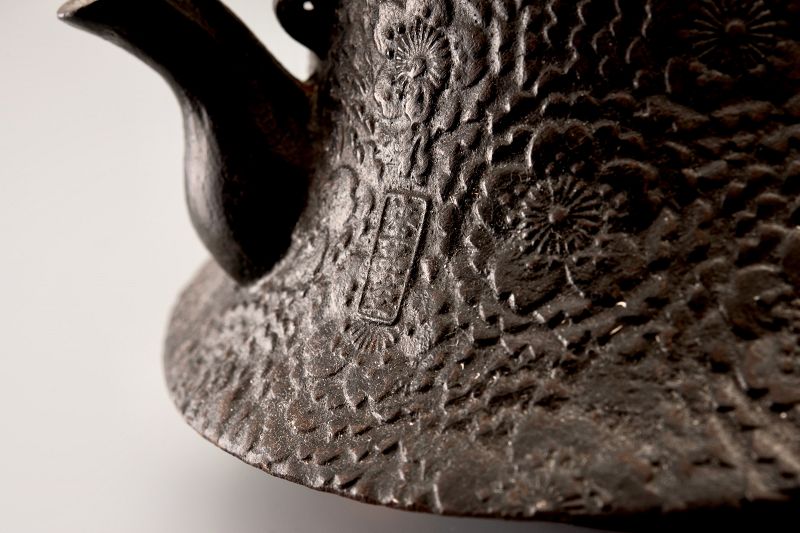 A Meiji Period “Tetsubin” Cast Iron Kettle with Cherry Blossom Motif