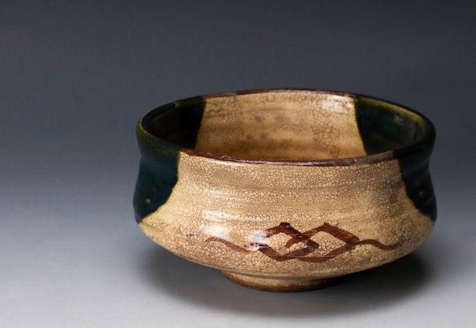 An Edo Period Oribe Tea Bowl with Green Glaze