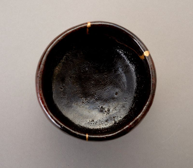 An Exceptional Antique Raku Tea Bowl with Gold Repair