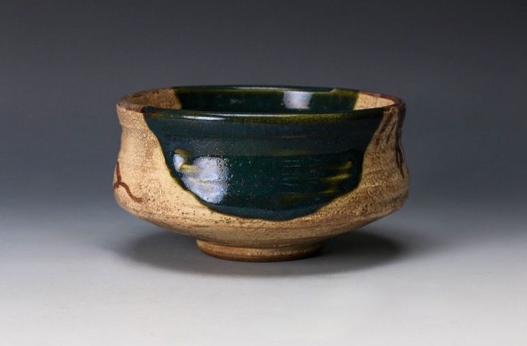 An Edo Period Oribe Tea Bowl with Green Glaze