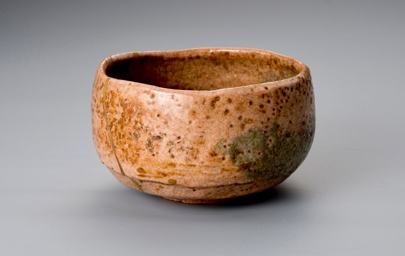 A Rare Tamamizu Red Raku Tea Bowl with Gold Repairs
