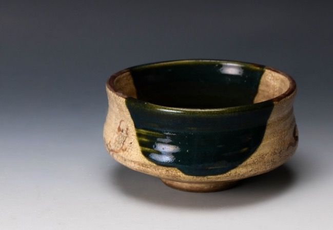 An Edo Period Oribe Tea Bowl with Green Glaze