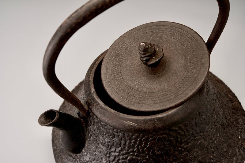 A Meiji Period “Tetsubin” Cast Iron Kettle with Cherry Blossom Motif
