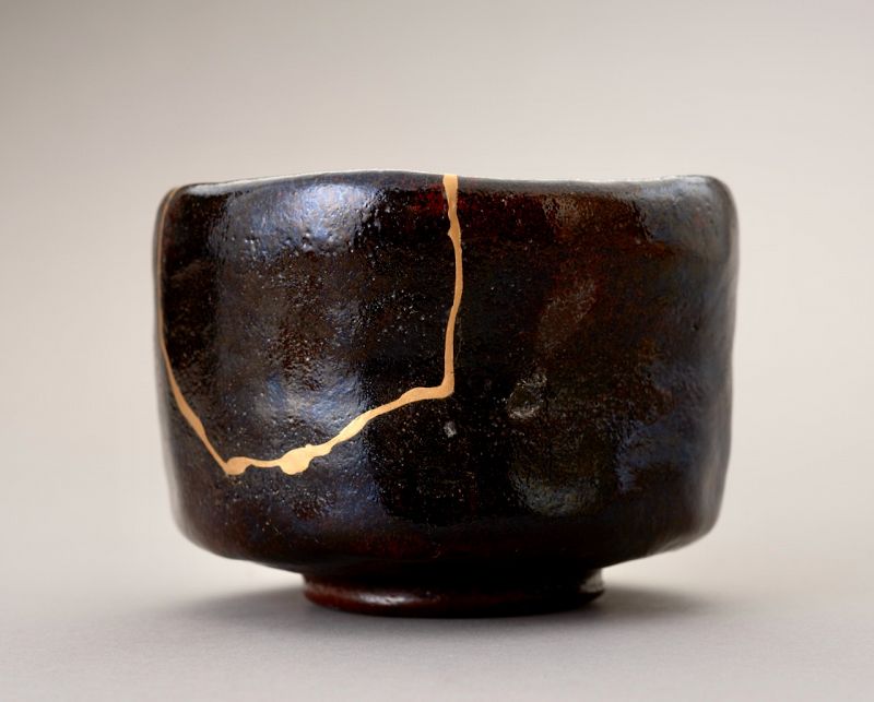 An Exceptional Antique Raku Tea Bowl with Gold Repair