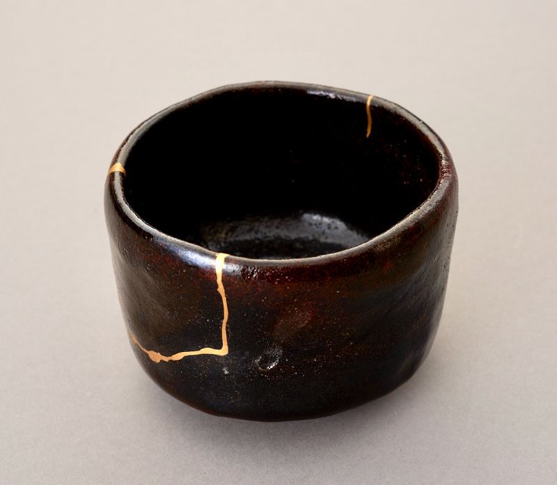 An Exceptional Antique Raku Tea Bowl with Gold Repair