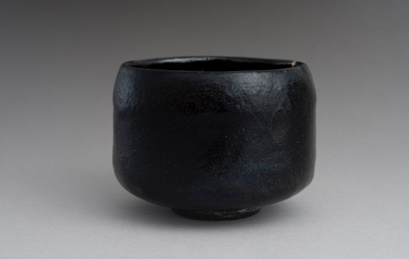 An Antique Black Raku Tea Bowl with Gold Repair