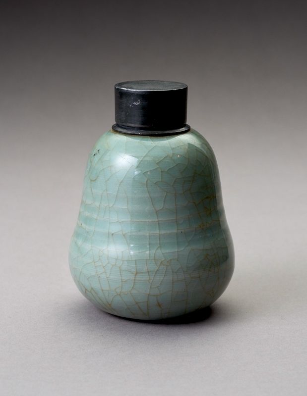 An Antique Celadon Tea Container with Pewter Cap