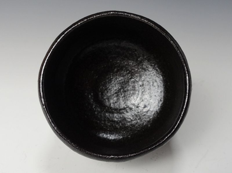 A Black Raku Tribute Tea Bowl by Kiraku Kizu