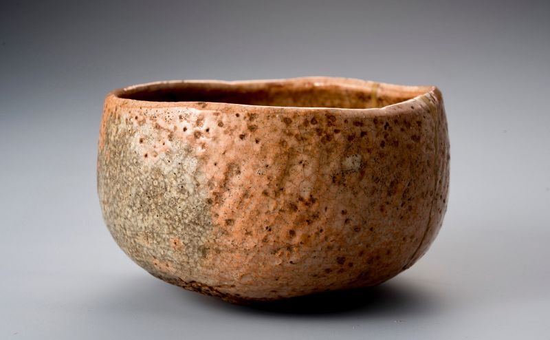A Rare Tamamizu Red Raku Tea Bowl with Gold Repairs