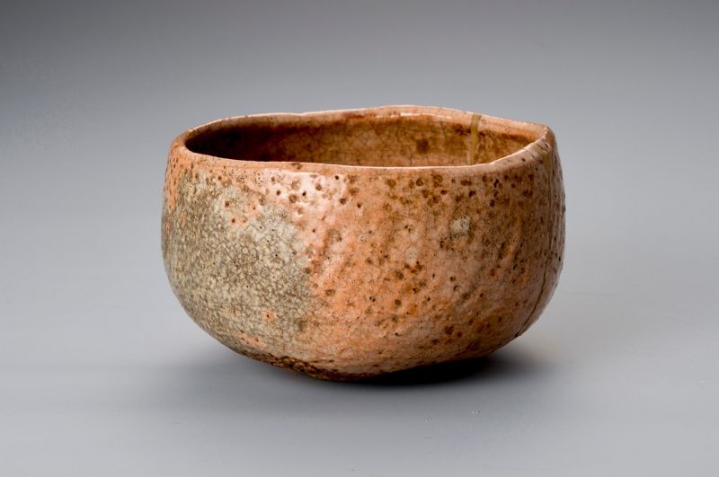 A Rare Tamamizu Red Raku Tea Bowl with Gold Repairs