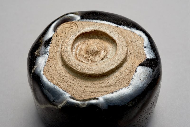 A Classic Black Raku Tea Bowl by Ōhi Chōzaemon IX