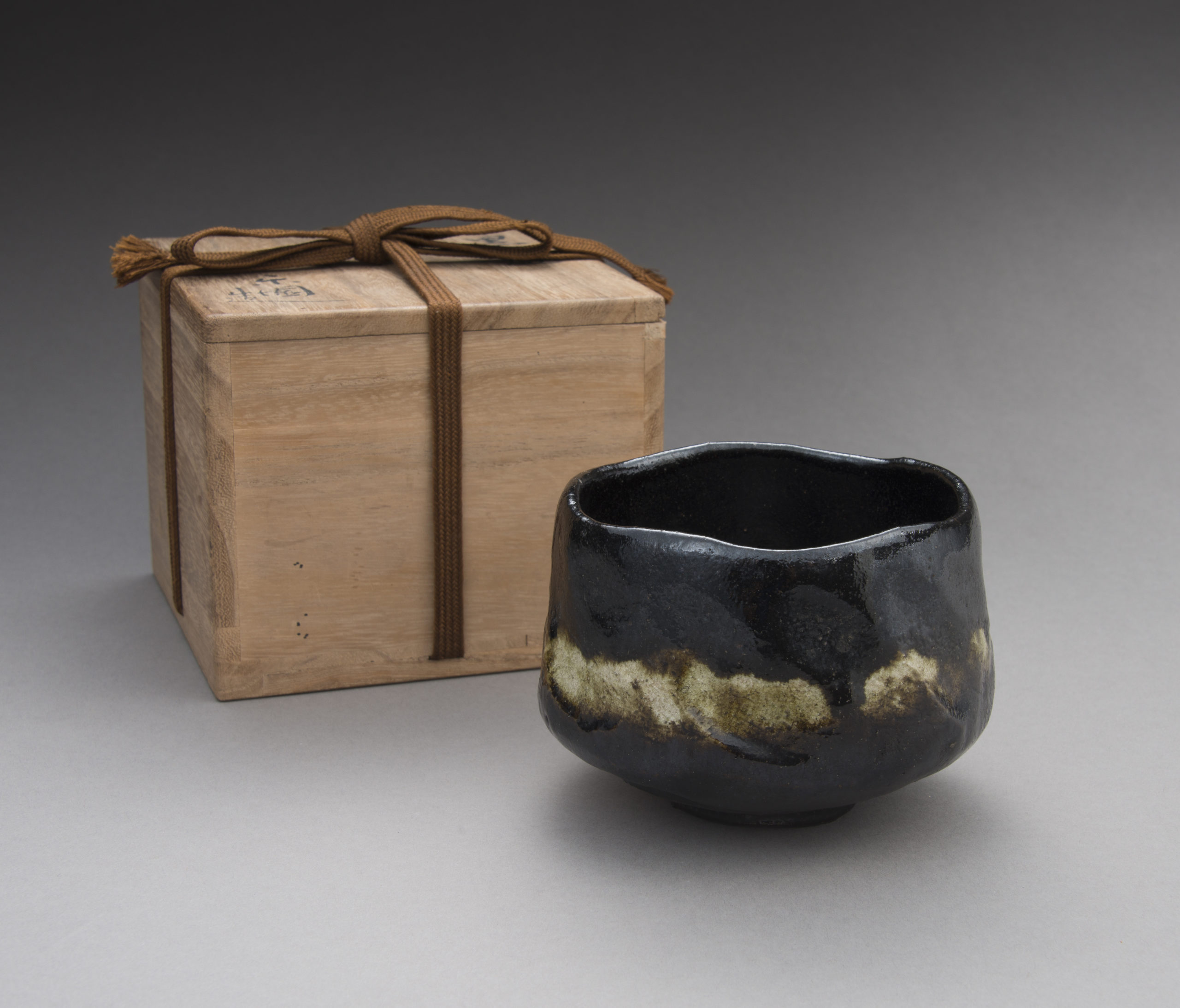 A Black Raku Tea Bowl by “Rakuen”