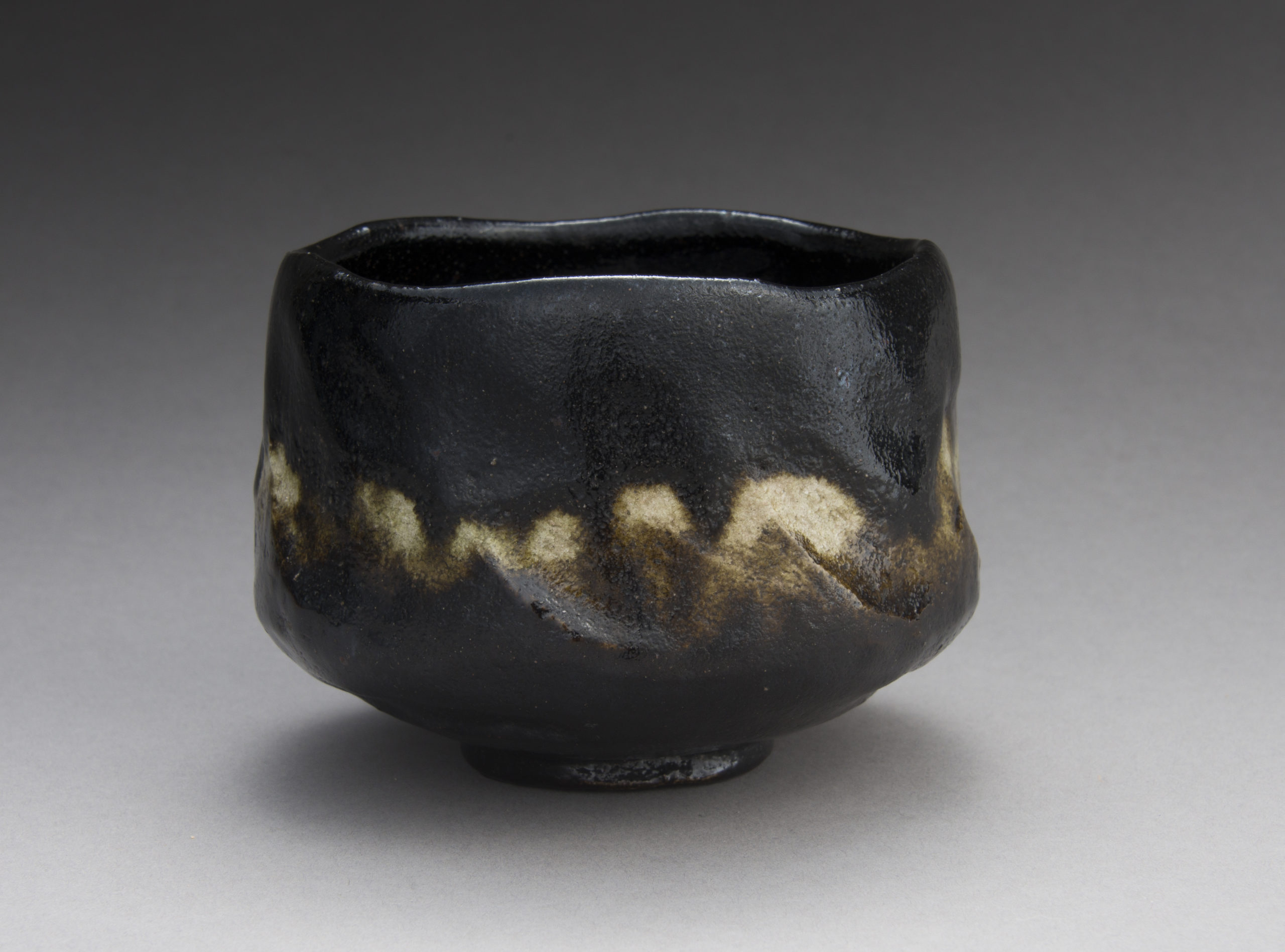 A Black Raku Tea Bowl by “Rakuen”