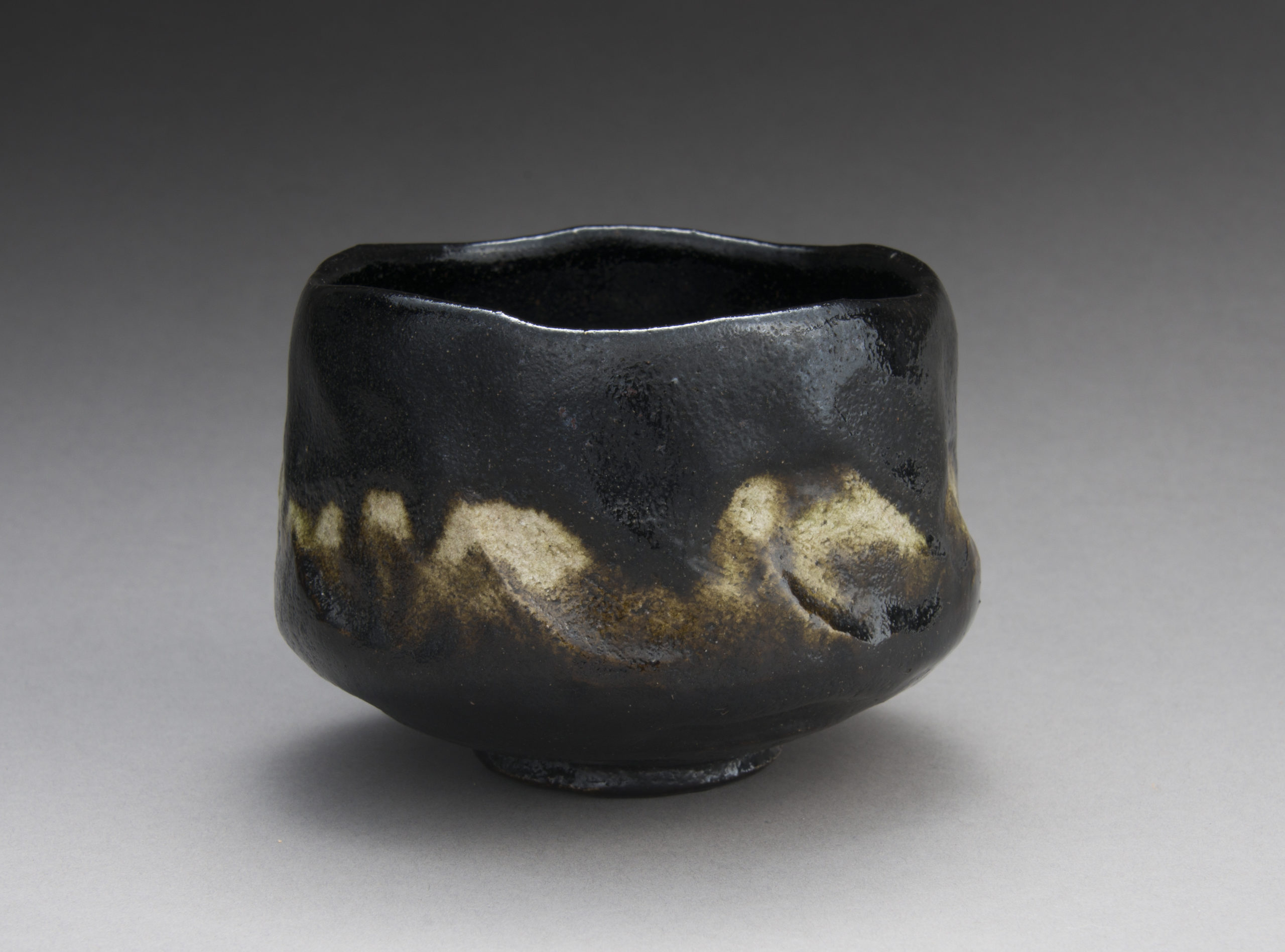 A Black Raku Tea Bowl by “Rakuen”