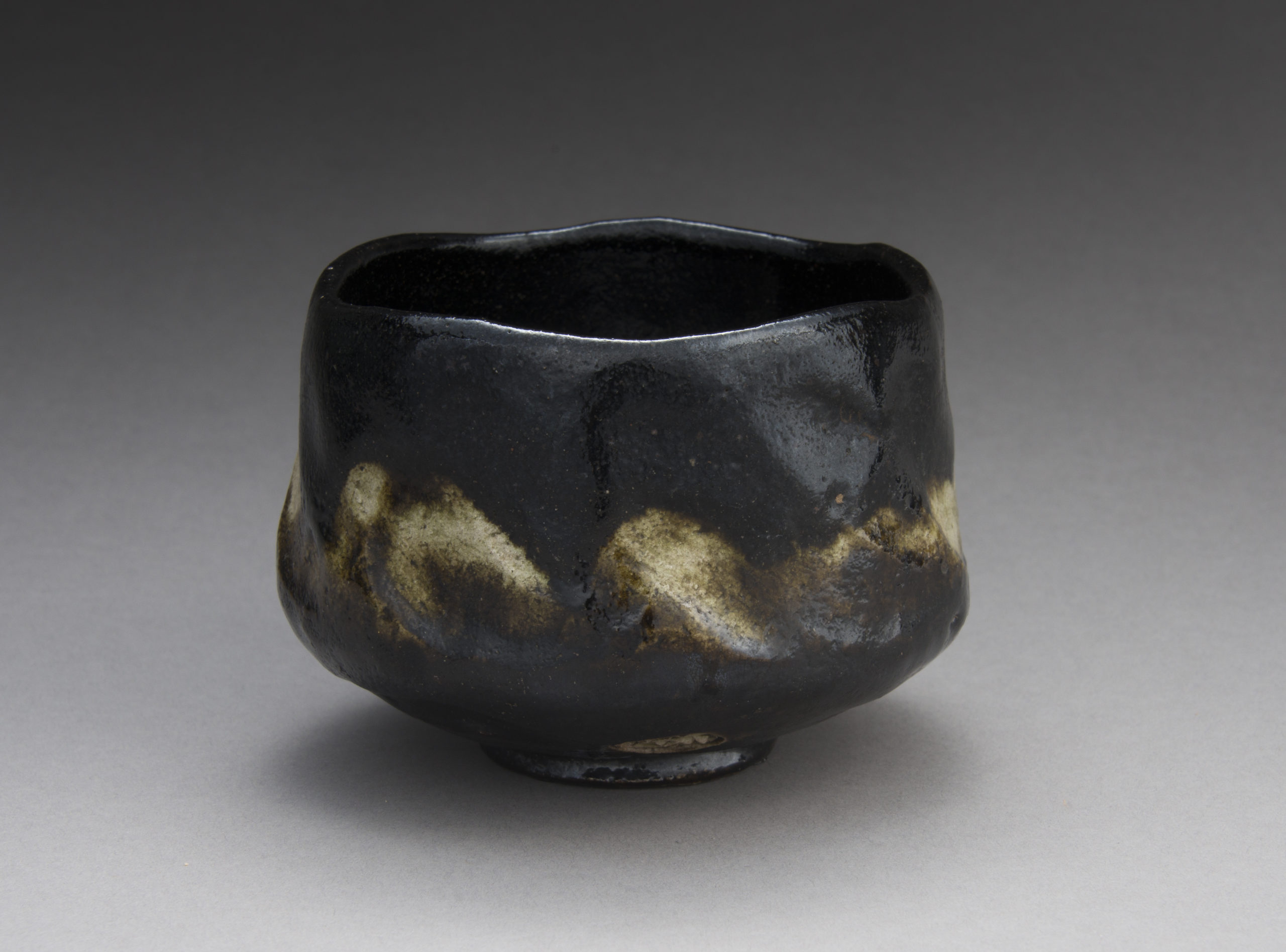 A Black Raku Tea Bowl by “Rakuen”