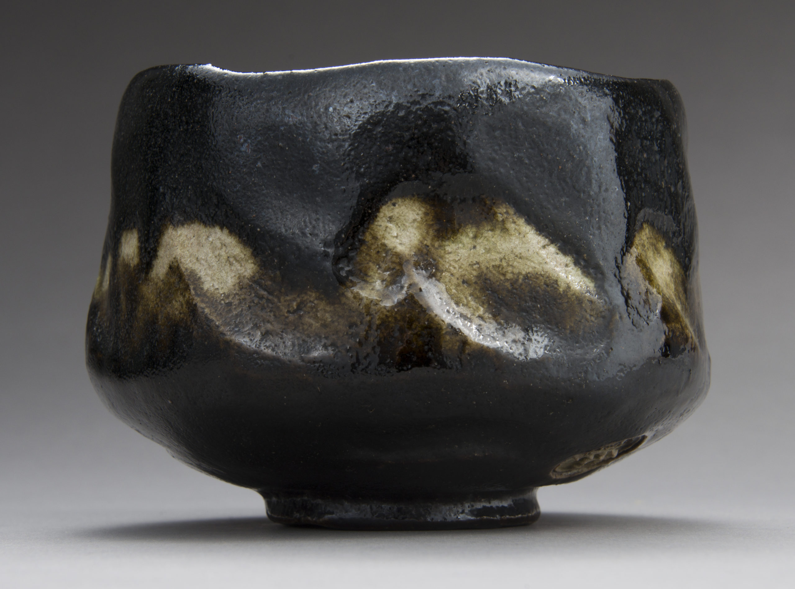 A Black Raku Tea Bowl by “Rakuen”