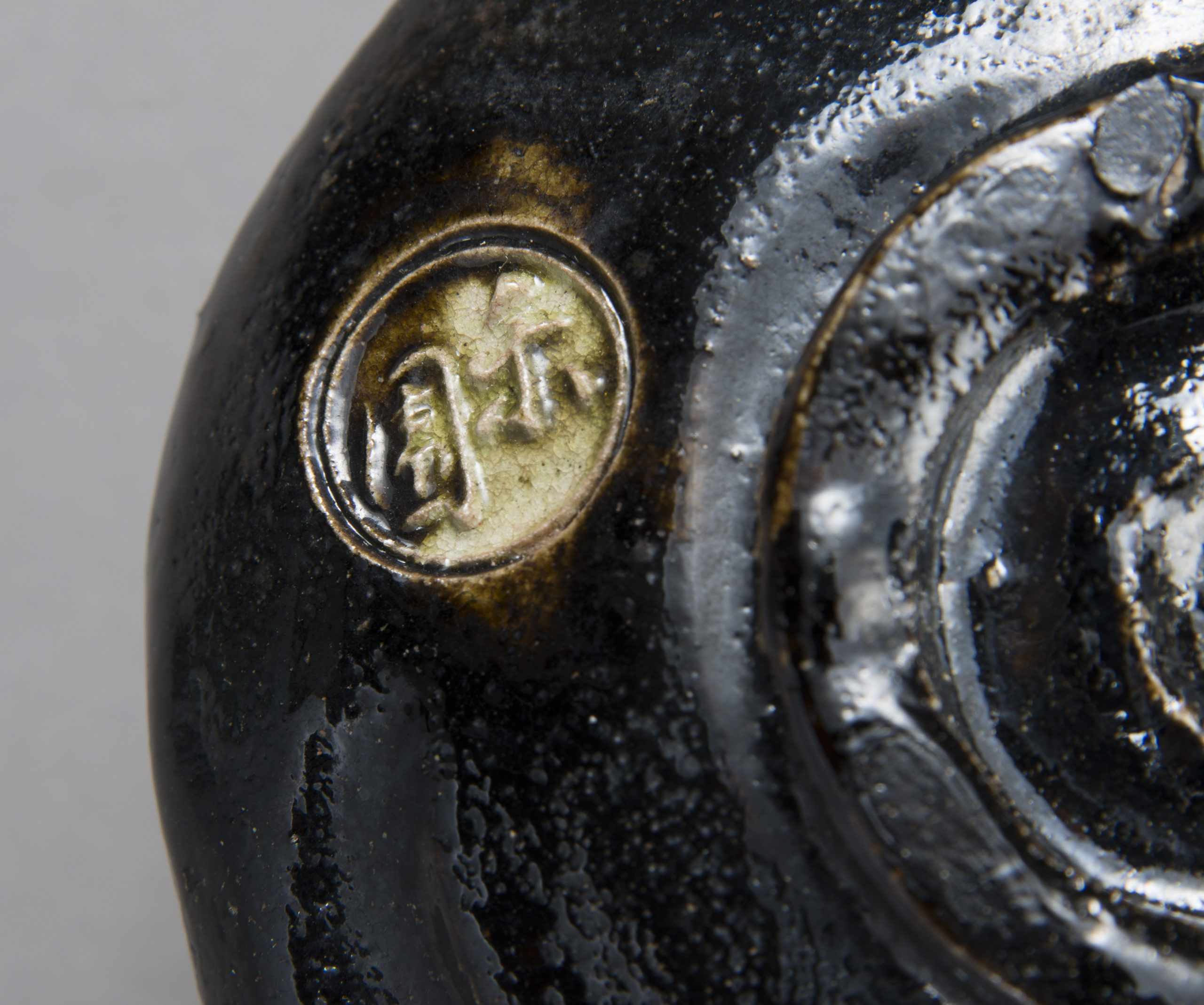 A Black Raku Tea Bowl by “Rakuen”