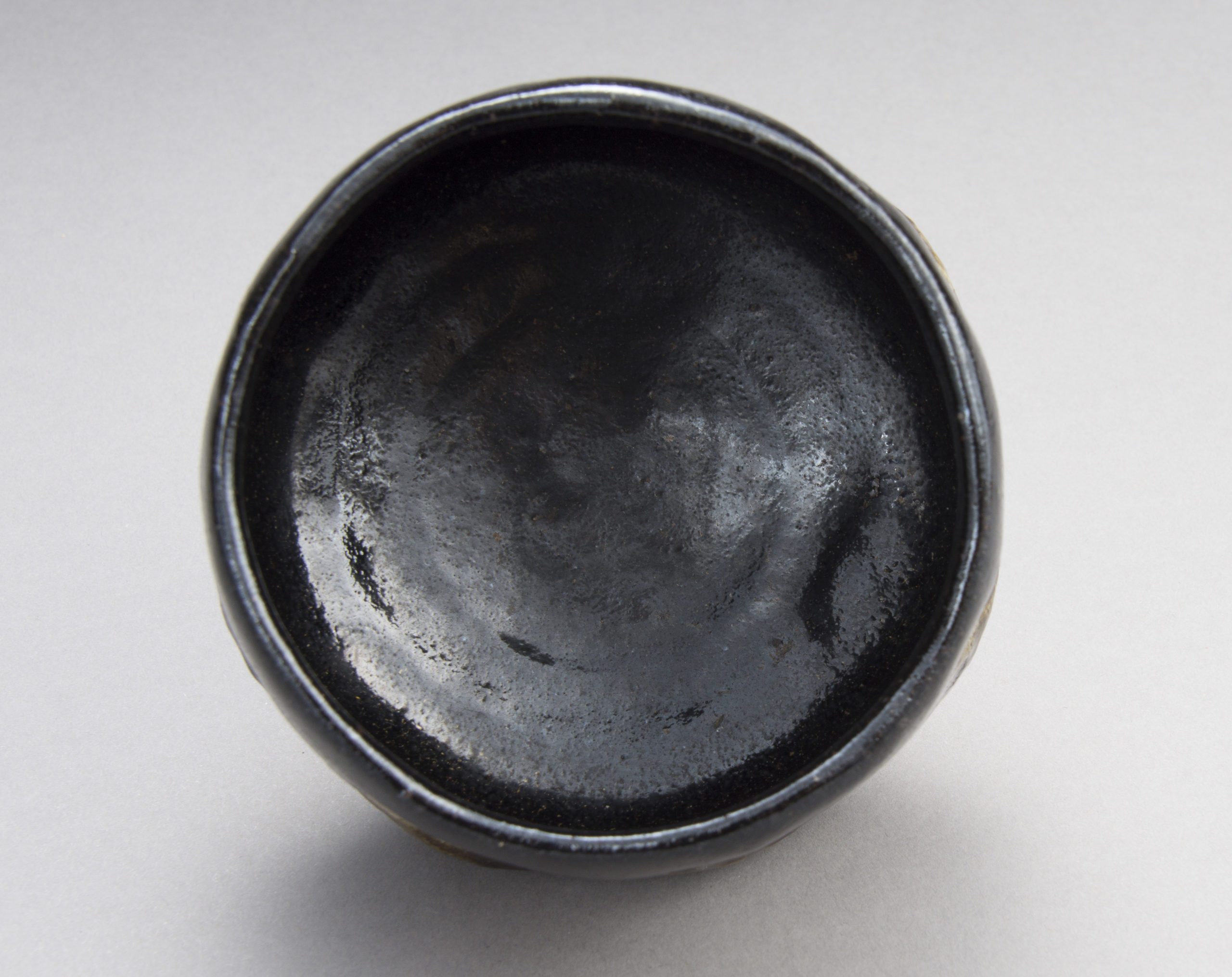A Black Raku Tea Bowl by “Rakuen”